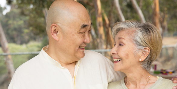 Old couple looking at each other and smiling